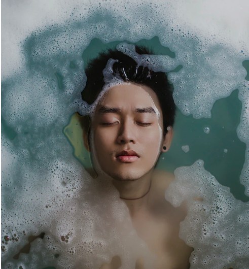 man bathing with washed hair